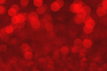 Red sparkling glitter bokeh background, christmas abstract defocused texture. Holiday lights