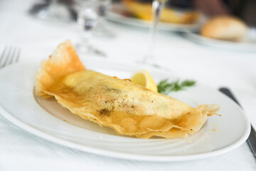 Traditional Tunisian fried pancake stuffed with egg