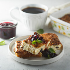 Traditional homemade cottage cheese pie with cherry sauce