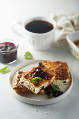 Traditional homemade cottage cheese pie with cherry sauce