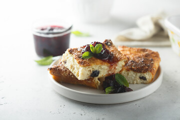 Traditional homemade cottage cheese pie with cherry sauce