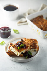 Traditional homemade cottage cheese pie with cherry sauce