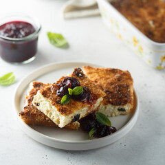 Traditional homemade cottage cheese pie with cherry sauce