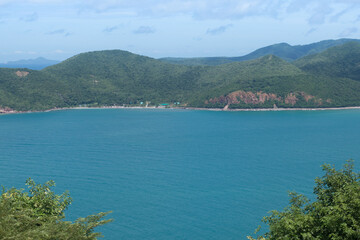 Panoramic view with island on blue sky and clouds