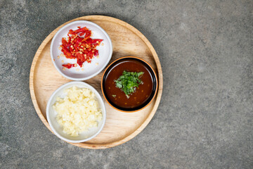 Sauce suki with chopped chili and garlic. You can add chopped chili and garlic.