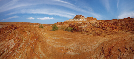 Red wavy sand stones, bluffs and cliifs at Glen Canyon National Recriation Area, Page, Arizona. Panorama