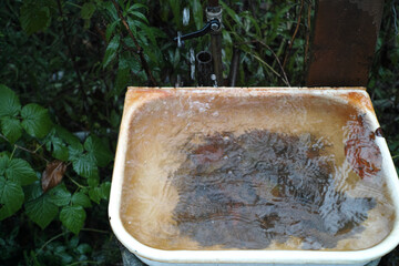 sink with clogged drain hole