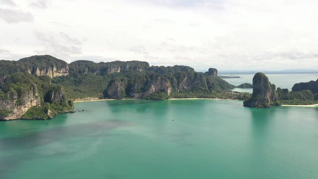 Aerial view of limestone mountains in Railey and Ao Nang beach at krabi province, Thailand, one of the most popular island in Andaman sea. Tourism, Travel destination and summer vacation concept.