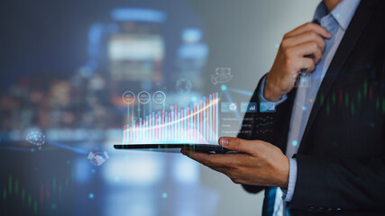 Businessman work with ai for economy analysis financial result by digital augmented reality graph. Concept for entrepreneur leader of invest in business and digital marketing technology of the future