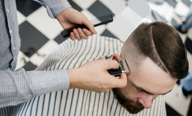 Stylish man visiting hairstylist
