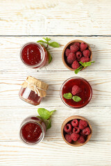 Flat lay composition with raspberry jam on wooden background
