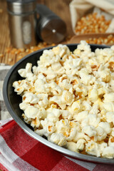 Concept of homemade popcorn on wooden background