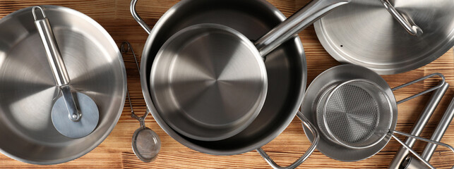 Kitchen utensil on wooden table, top view