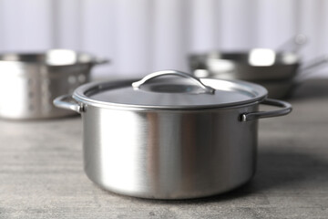 Kitchen utensil on gray textured table, selective focus