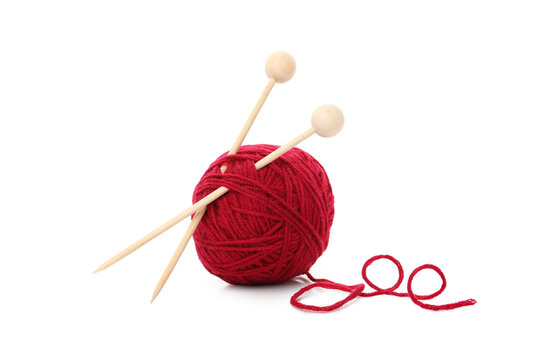 Red yarn ball with knitting needles, isolated on white background