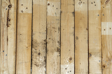 Rustic wood planks used to form a smooth surface such as a floor or table.
