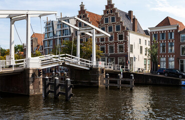 The photo shows a folding bridge over the river Spaarne in Harleem, Netherland