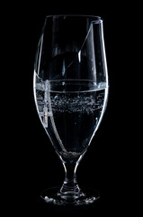 a Christian cross in a bowl of water