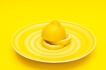 lemon on a yellow plate close-up