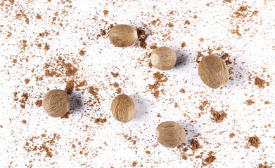 Pile ground, milled and grain nutmeg powder isolated on white background, top view 