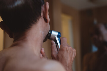Fototapeta premium Senior man using shaving in toilet, Lifestyle of men’s daily routine.
