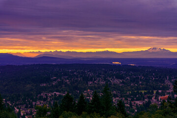 Fototapeta premium Sunrise over valley and distant alpine mountains, BC, Canada.
