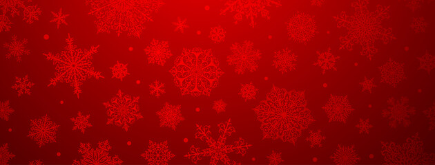 Christmas background of big and small complex snowflakes in red colors