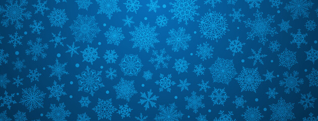 Christmas background of big and small complex snowflakes in blue colors