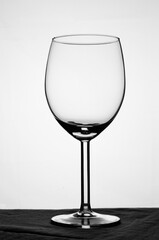 wineglass on white background and black floor