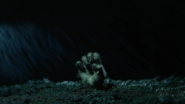 Zombie rises from the grave at the rain