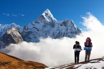Papier Peint photo Ama Dablam Mount Ama Dablam with two tourists, Himalayas mountains