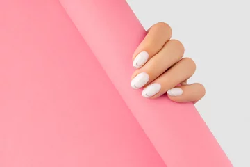 Tuinposter Womans hands with trendy white french manicure © Darya Lavinskaya