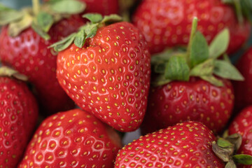 Ripe red strawberries on a plate