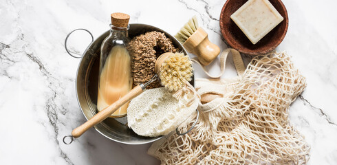 Banner concept accessories for kitchen cleaning - natural bristle brushes, loofah sponges, natural...