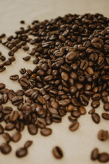 Coffee beans on brown background.