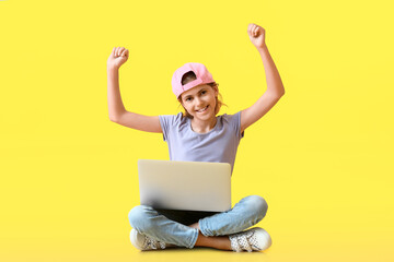 Little programmer with laptop on color background