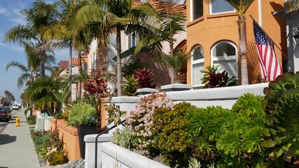 California typical suburban street, tropical Oceanside USA. Different colorful houses row. Generic american homes, buildings facade, townhouse exterior architecture. Residential district real estate.