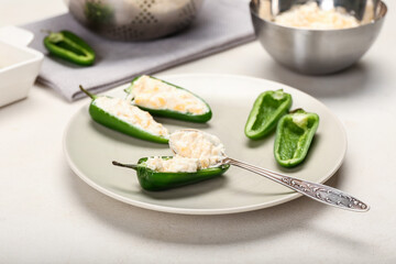 Preparing of jalapeno poppers on white background, closeup