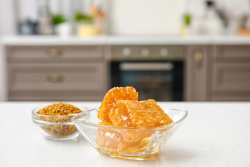 Bowl of honey combs on table in kitchen