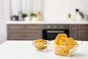 Bowl of honey combs on table in kitchen