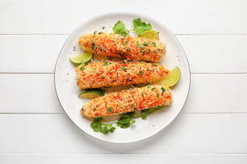 Plate with tasty Elote Mexican Street Corn on white wooden background