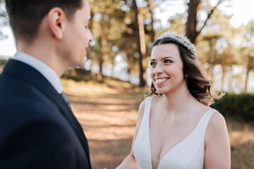 Just married couple looking at each other