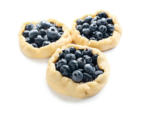 Raw blueberry galettes on white background