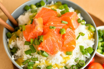 Tasty poke bowl on table, closeup