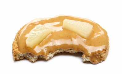 Peanut butter spread on slice of bread with fruit pineapple isolated on white background