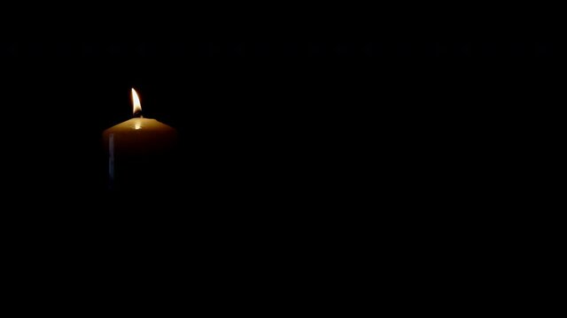 light candle isolated on black background left side of picture shot in 4k super slow motion