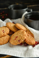 Delicious cranberry cookies on table, closeup