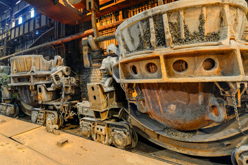 Large metallurgical slag ladles on railroad trolleys