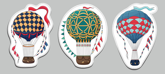 Set of Vintage hot air balloon stickers. Different balloon aerostat sticker. Color air balloons isolated. Large bag filled with hot gas and basket. Flying transport. Hand drawn vintage style flight ai © Belchatina