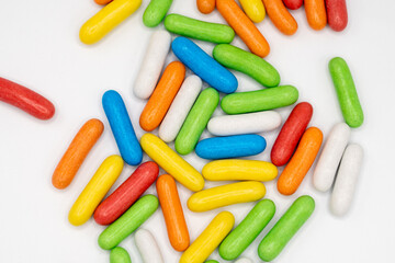 handful of colorful sweet candies on light background